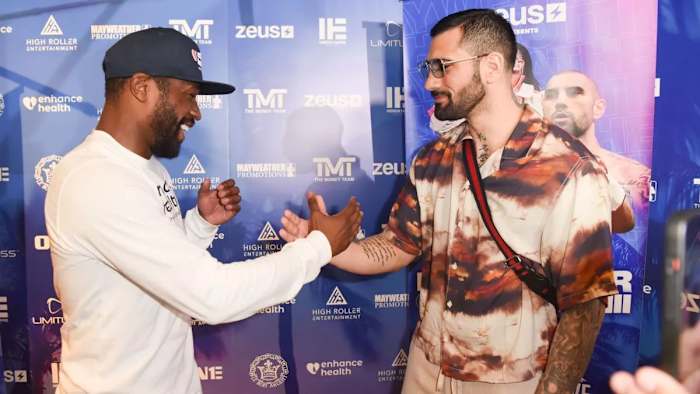 Floyd Mayweather and John Gotti III embrace before their exhibition boxing match in Sunrise, Florida.